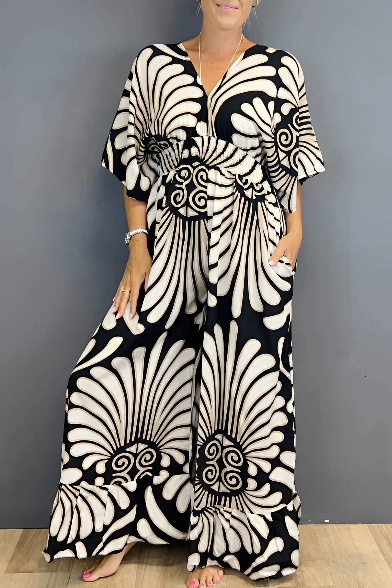 Charm | Women’s floral jumpsuit with flounce sleeves and fitted waist