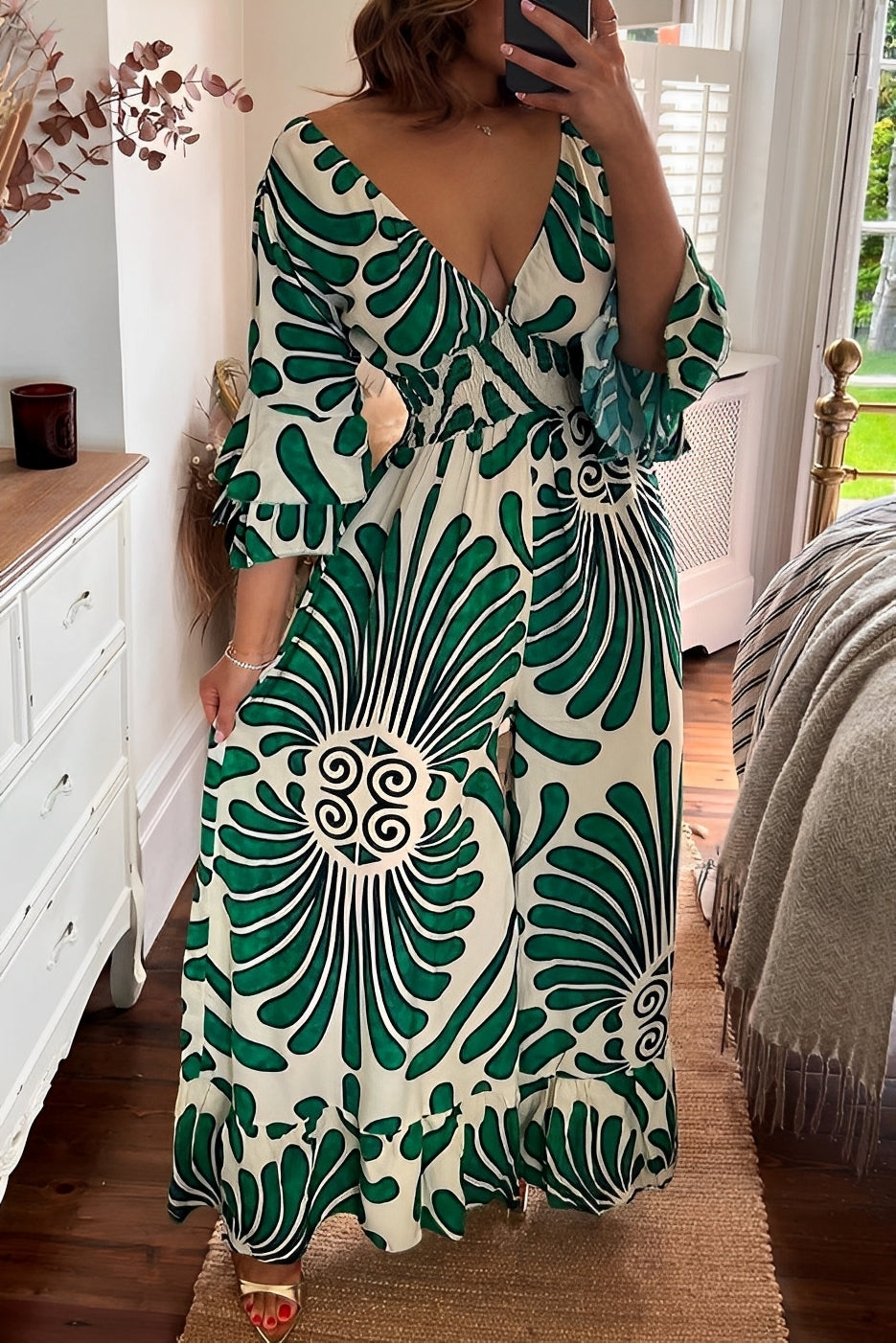 Charm | Women’s floral jumpsuit with flounce sleeves and fitted waist