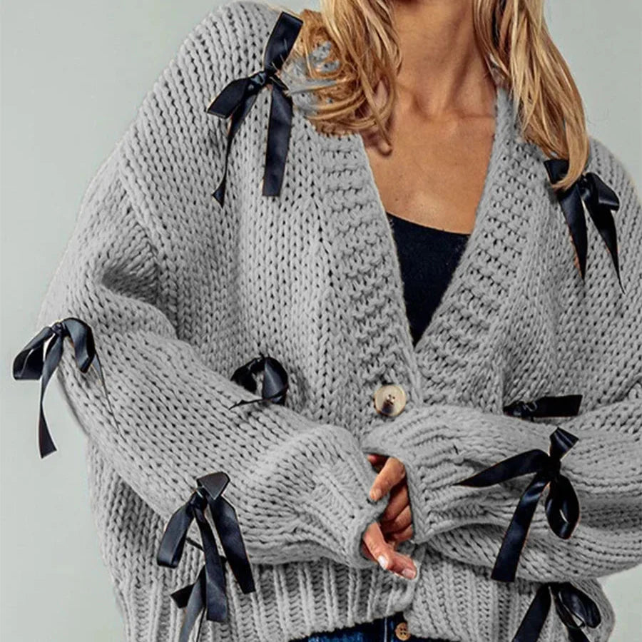 Belle | Women’s chunky cable knit cardigan with bow trim accents