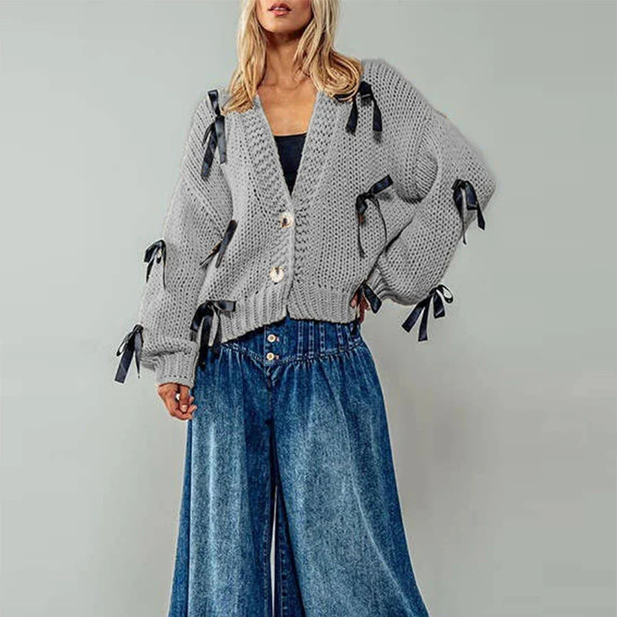 Belle | Women’s chunky cable knit cardigan with bow trim accents