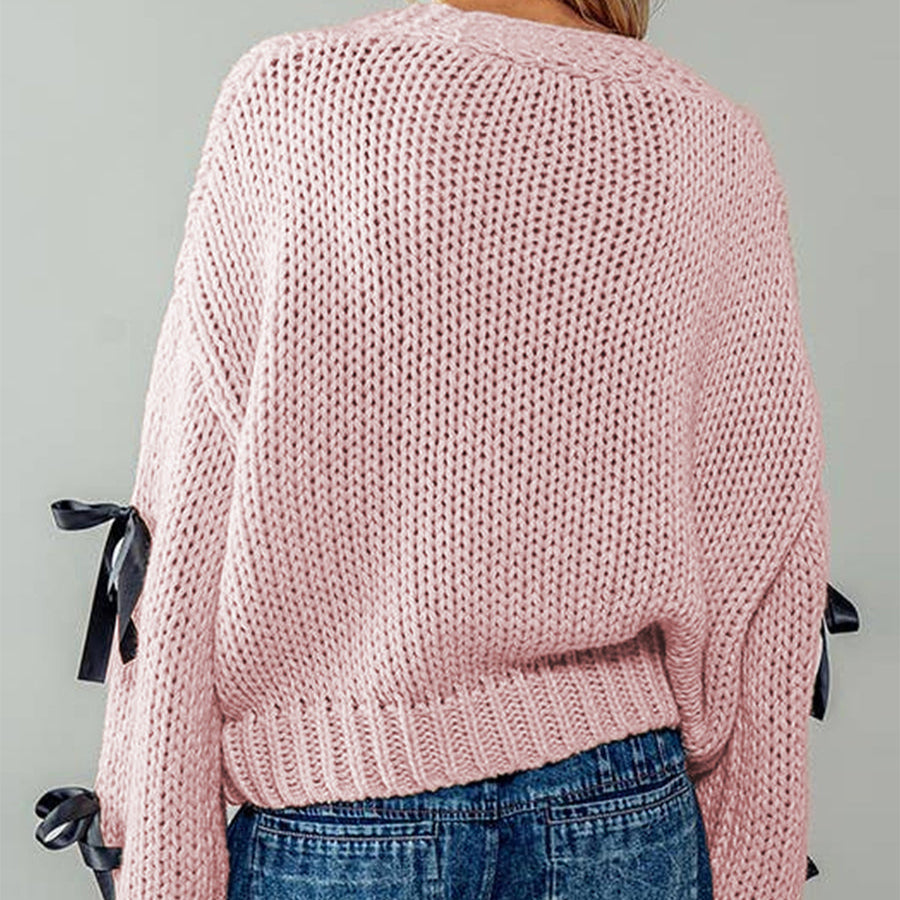 Belle | Women’s chunky cable knit cardigan with bow trim accents