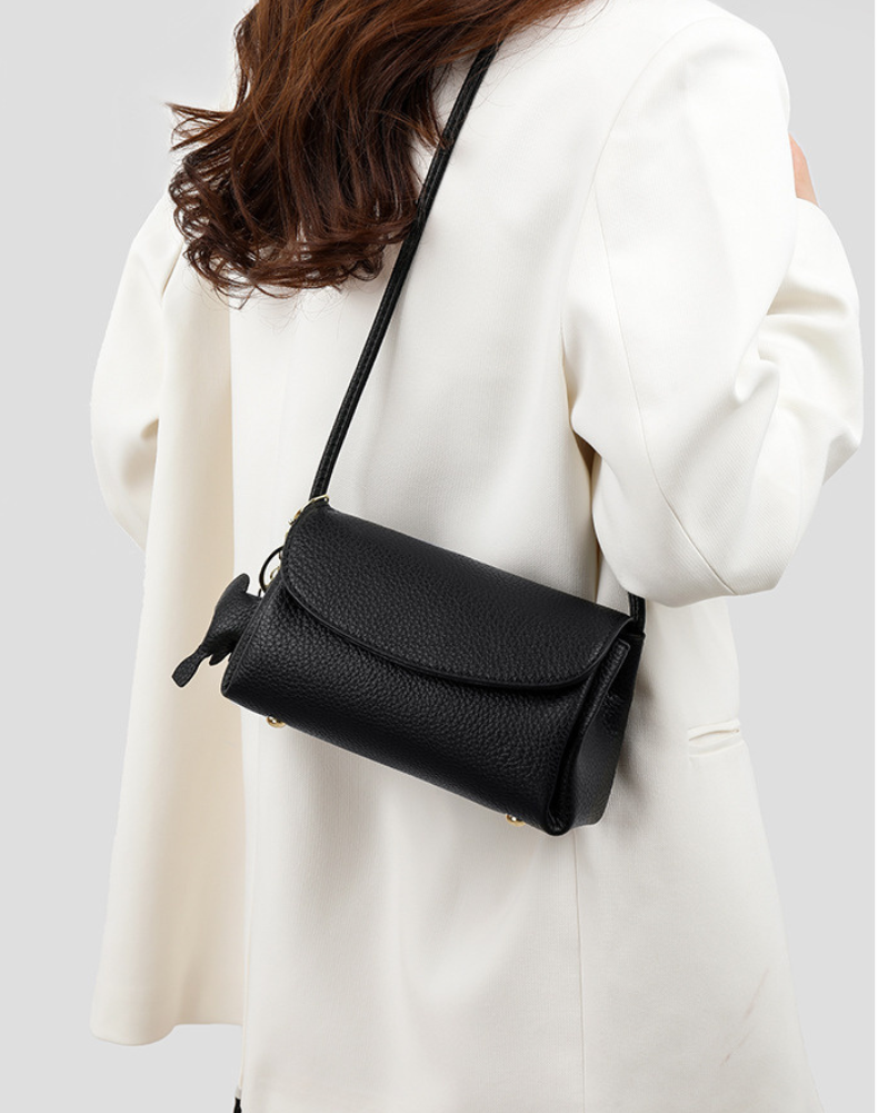 Chloe | Women’s crossbody bag with flap closure and playful detail