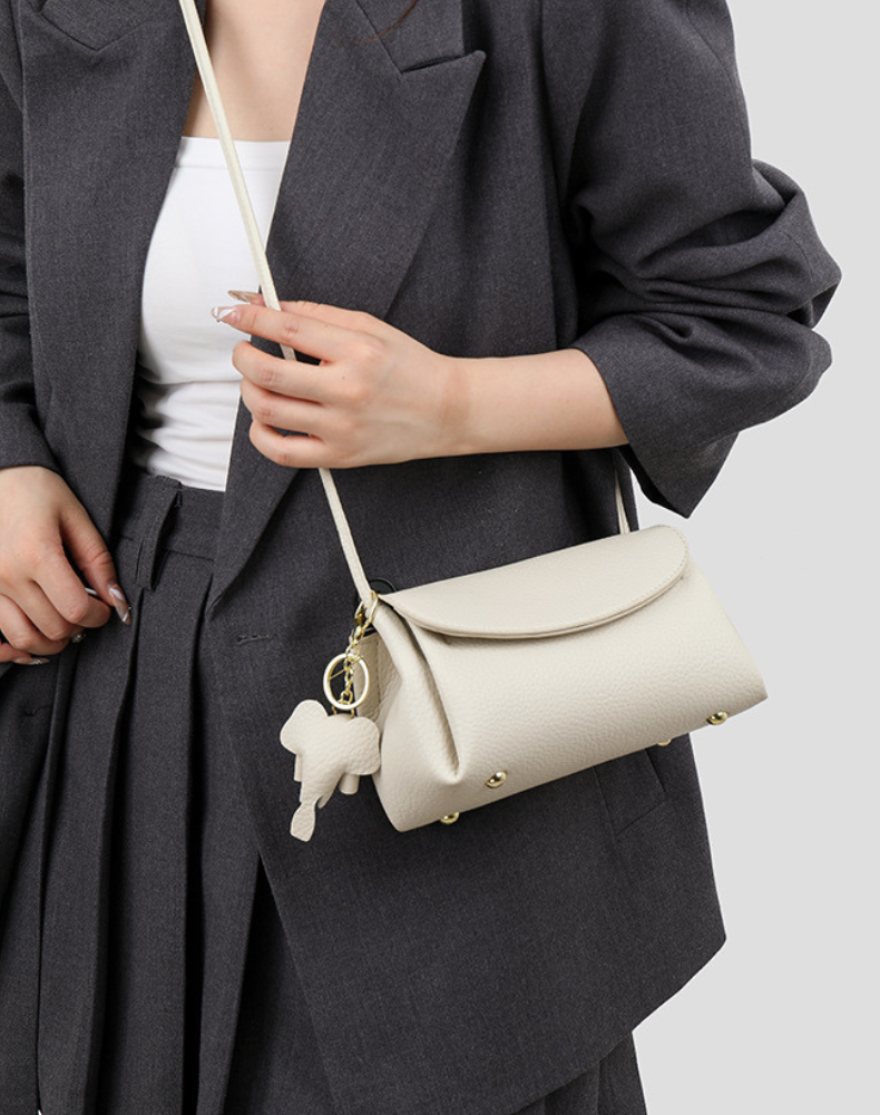 Chloe | Women’s crossbody bag with flap closure and playful detail
