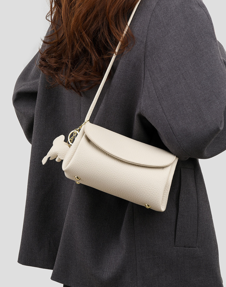 Chloe | Women’s crossbody bag with flap closure and playful detail