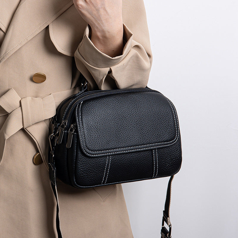 Luna | Women’s round handbag with zipper closure and dual straps