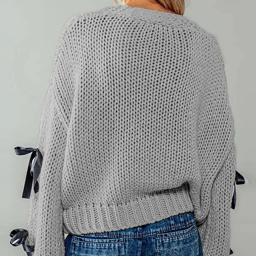 Belle | Women’s chunky cable knit cardigan with bow trim accents
