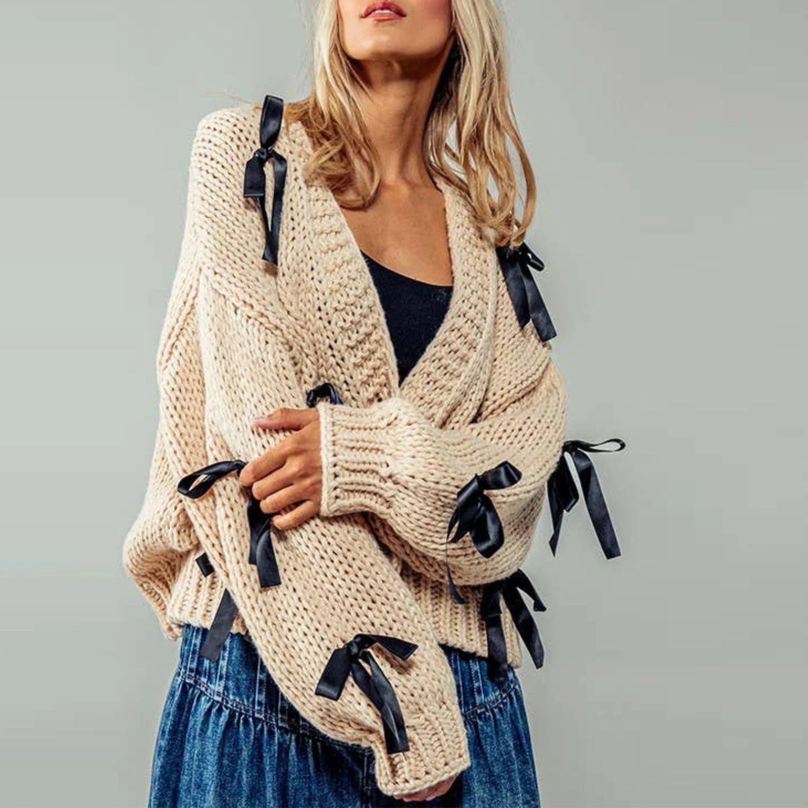 Belle | Women’s chunky cable knit cardigan with bow trim accents